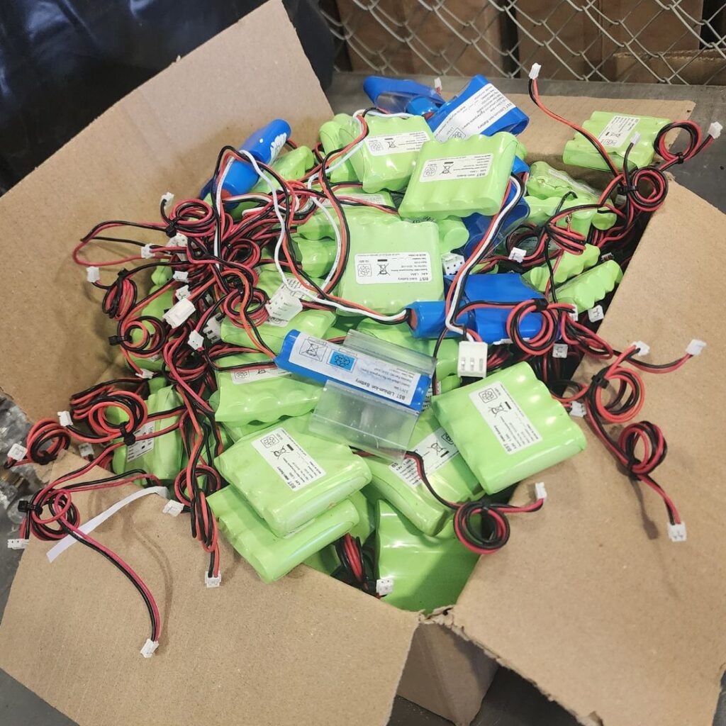 Box full of batteries removed from AS/NZS2293 electric-battery Exit Signs